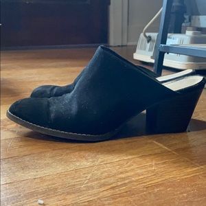Black suede clogs with a small heel
